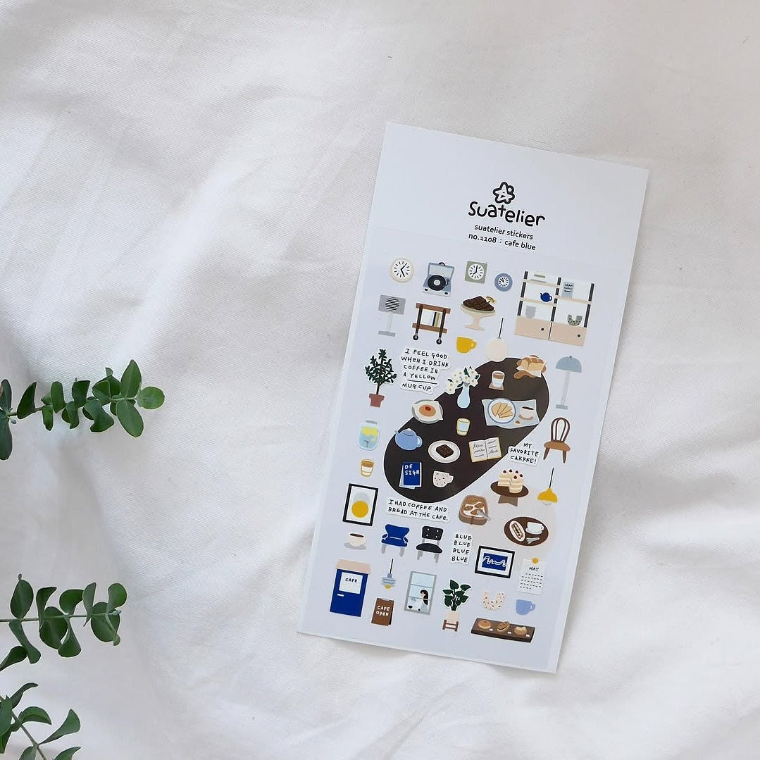 Sheet of stickers with various illustrations on a white surface, featuring the brand 'Suettier'.