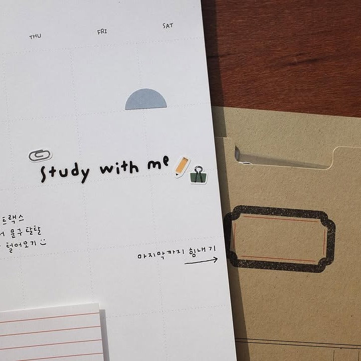 Notebook with 'Study with me' text and a brown folder on a wooden surface, from the Deco 07 Sticker Sheet