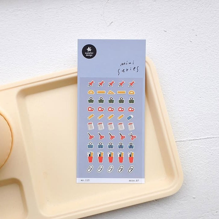 Deco 07 Sticker Sheet by Suatelier, small icons on a light blue background with a beige tray below