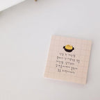 Notebook with grid pattern and text on a light gray background