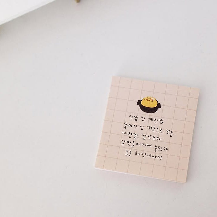 Grid notebook with text on a light grey background, from the Food Trip 6 Sticker Sheet