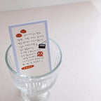 Card with illustrations and text inside a glass container on a white background
