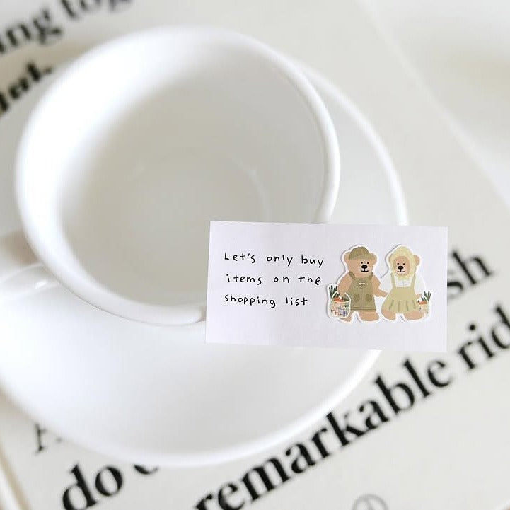 White mug with a card and two teddy bear illustrations, from the Ggumi Farm Sticker Sheet