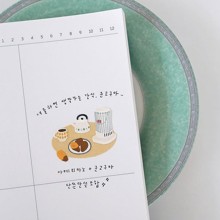 Calendar with a penguin and cup illustration on a green plate, from the Grandpa's Room Sticker Sheet