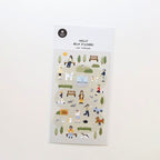 Sheet of decorative stickers with people and animals in a park on a white background