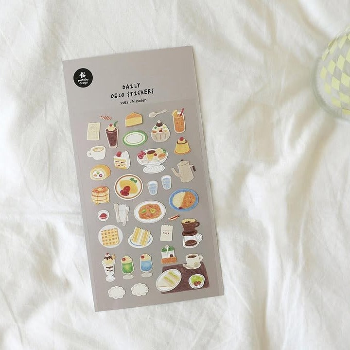 Pack of decorative stickers with food and drink illustrations on a white surface