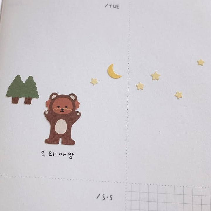 Illustration of a bear with trees, moon and stars, from the Let's go Camping Sticker Sheet