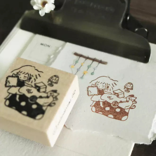 Mini Girls Sweet Dreams stamp with its printed impression displayed on a white surface