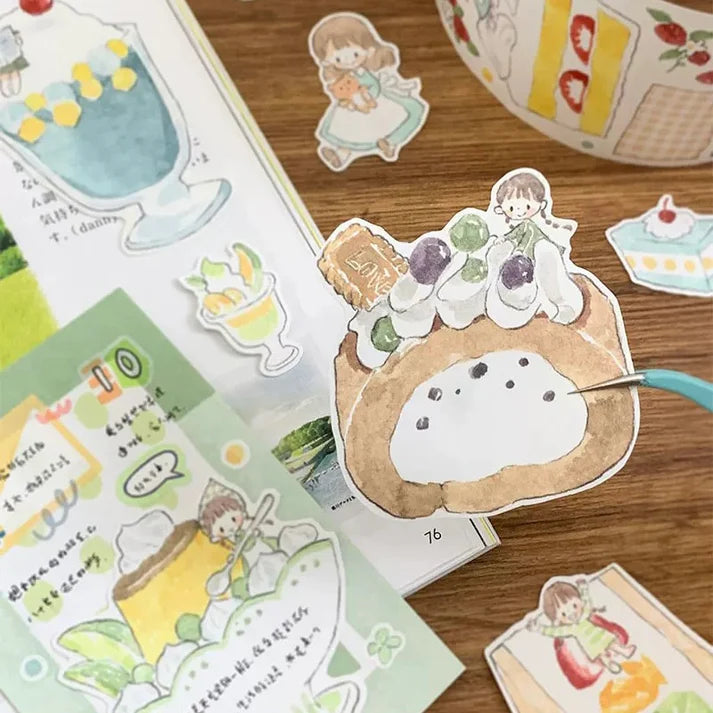 Collection of cute illustrated stickers on a wooden surface