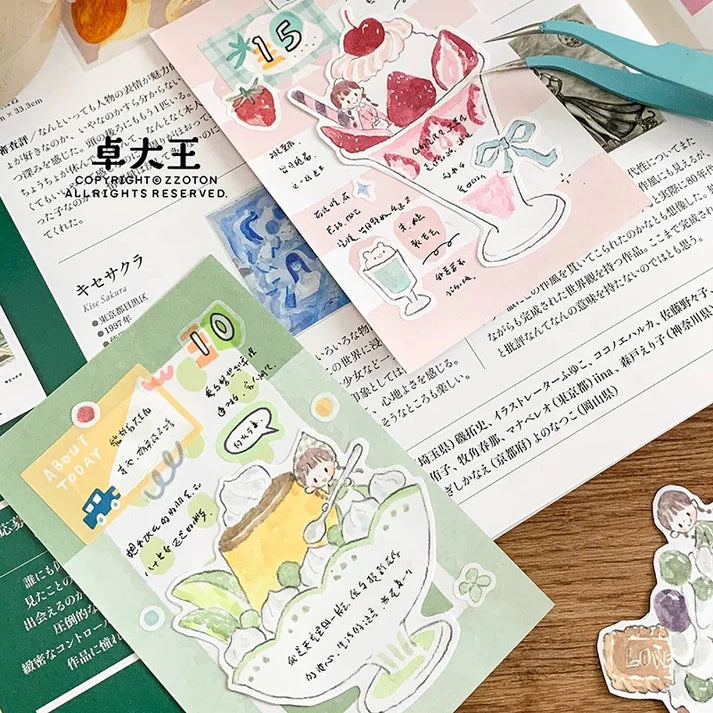 Sticker sheet with illustrations and text on a wooden surface