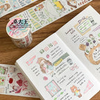 Sticker book with cute illustrations and a roll of decorative tape on a wooden surface.