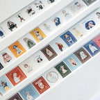Set of decorative tape rolls with cartoon character designs on a white background