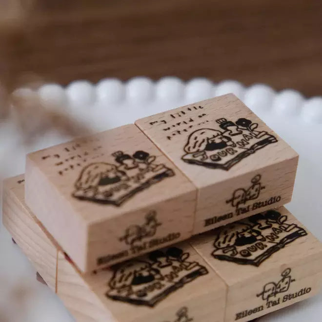 My World on Paper wooden stamps with Eileen Tai Studio branding on a soft blurred backdrop