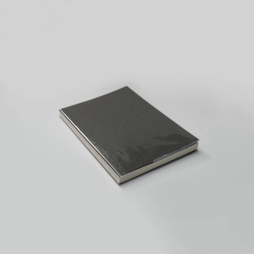 Black notebook on a light gray background
