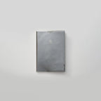 Gray notebook with a logo on a light gray background