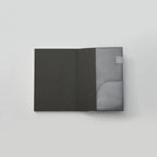 Black leather wallet with a clear card holder on a light gray background