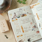 Planner with daily tasks and illustrations on a desk with stationery items