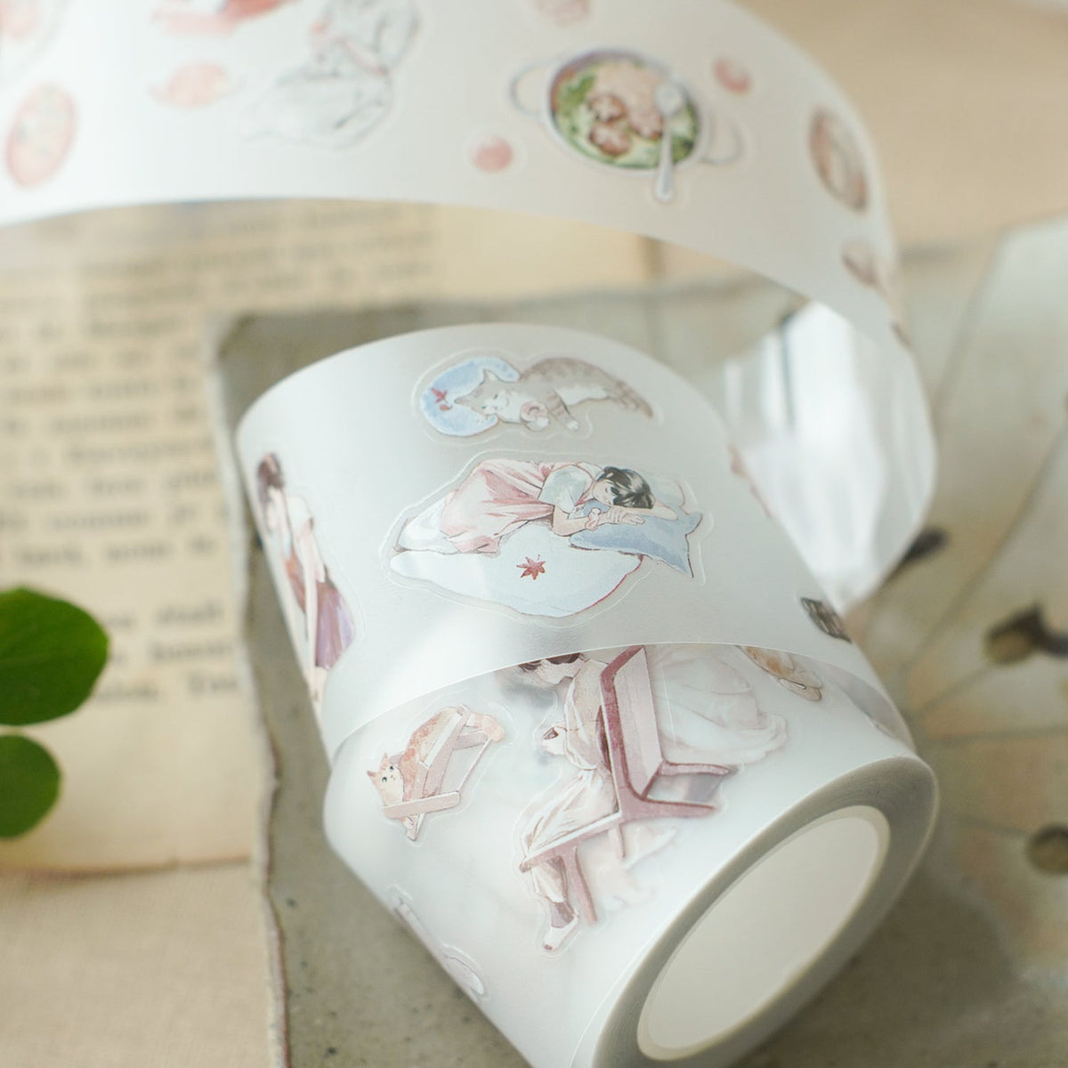 Aki No Heya PET Tape roll with Japanese-inspired illustrations resting on a textured surface
