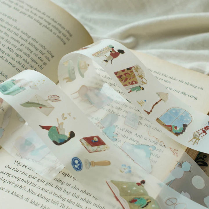 Enchanted Library PET Tape literary illustrations decorating a book page, close-up detail