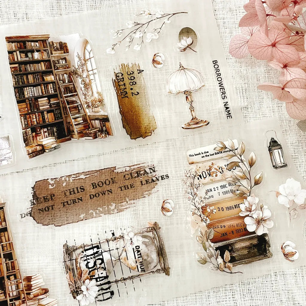 The Cosy Chapter PET Tape book-themed collage with flowers and deco elements on texture