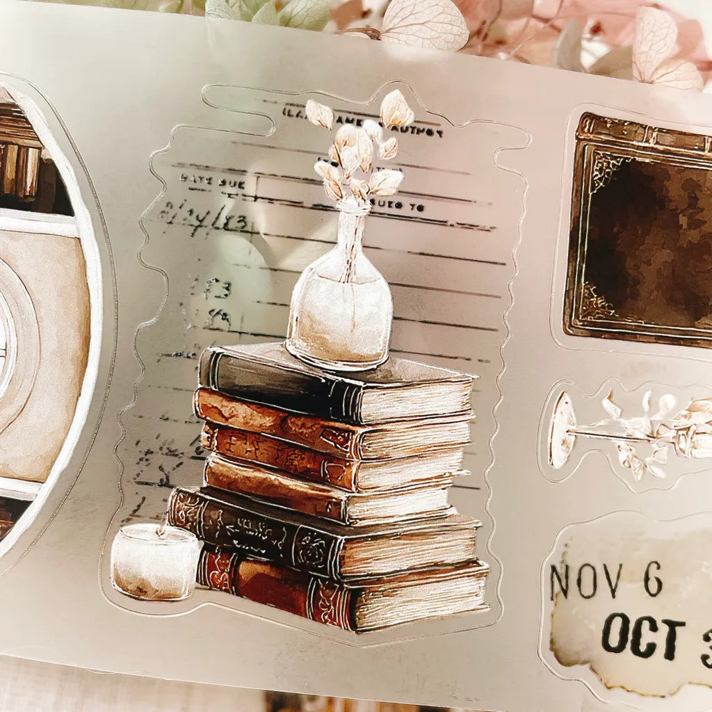The Cosy Chapter PET Tape vintage book stack design with a small vase against deco backdrop