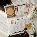 Decorative letter with illustrations and text on a wooden surface