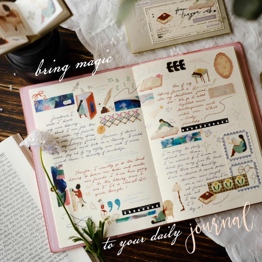 Open daily journal with illustrations and text on a wooden surface.
