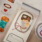 Card with illustration of a cake and envelope on a textured surface