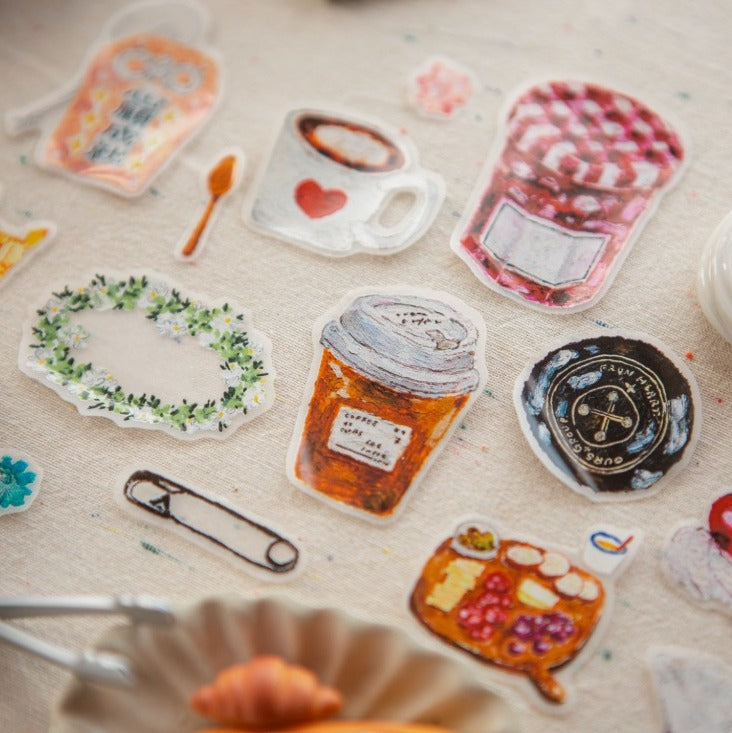 The Gift PET Tape food and drink designs styled as paper clips on a textured surface