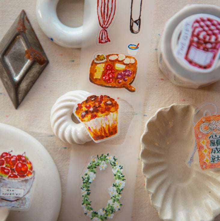 The Gift PET Tape designs styled on ceramic and plastic items on a light background