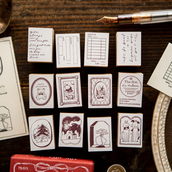 Collection of small printed cards with various designs on a wooden surface.