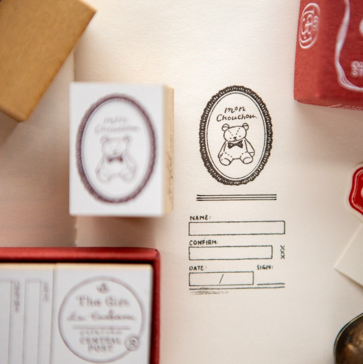 Collection of The Gift Series vintage-style rubber stamps on a white background, styled detail view