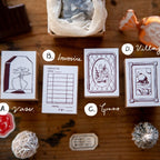 Collection of vintage-style stamps on a wooden surface with decorative items.
