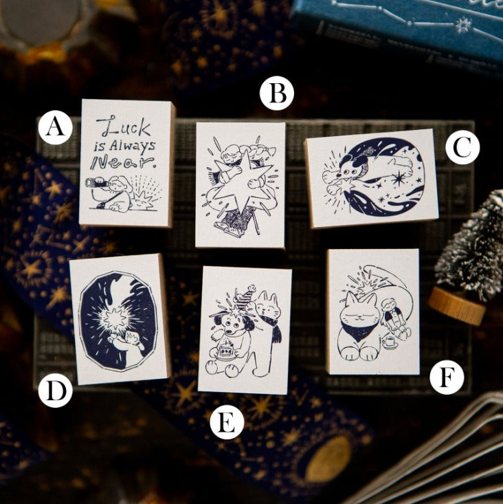 Set of six cards with various designs on a dark background
