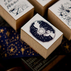 Small brown boxes with white labels featuring star designs on a dark background