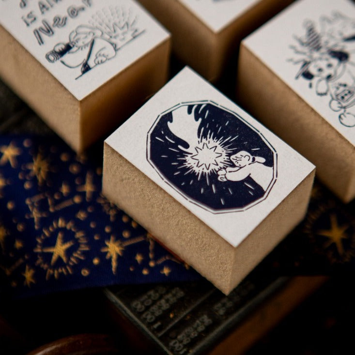 Small boxes stamped with Lucky Star Series star label designs on a dark background