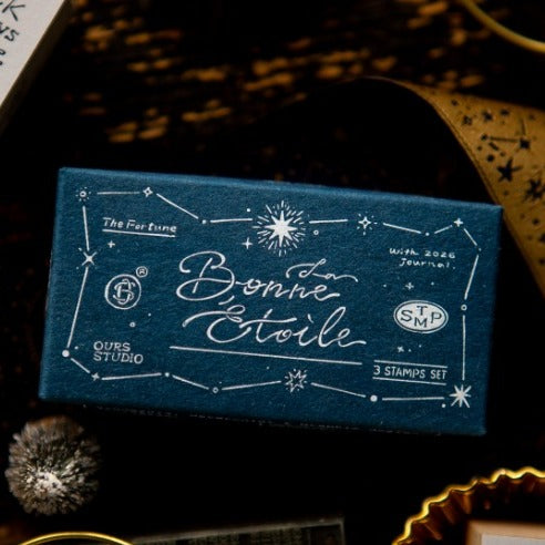 Lucky Star Series stamped La Bonne Etoile design on blue packaging on a dark surface