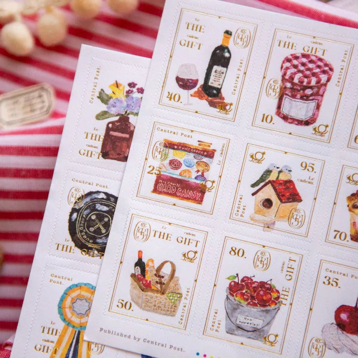 The Gift Stamp Sticker Sheet by OURS Studio — 'The Gift' stamp stickers on striped background, for journaling