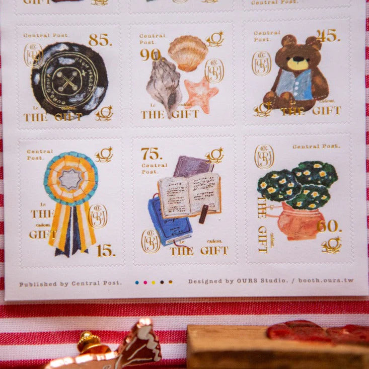 The Gift Stamp Sticker Sheet by OURS Studio — illustrated stamp stickers on white, for journaling