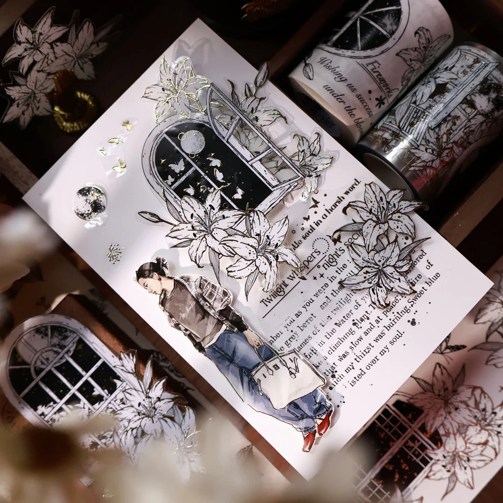 Decorative book with illustrations of a woman, flowers, and text on a wooden surface.