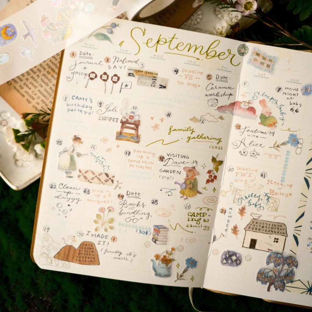 Open notebook with a September calendar page filled with illustrations and text.