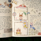 Open book with illustrated fox characters and decorative elements on a white background