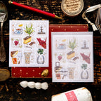 Sticker pack with illustrations of food and drinks on a wooden surface with stationery items.