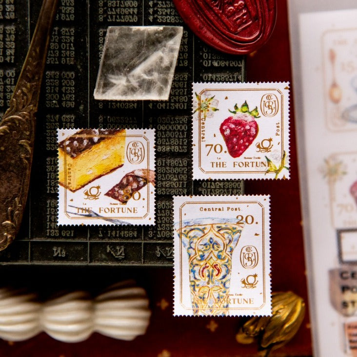 Collection of decorative stamps with intricate designs and text on a textured surface.