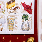 Collection of decorative stamps with various symbols on a red background