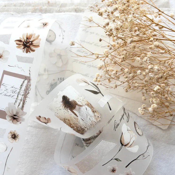 Glass decorated with a Timeless PET Tape floral design on marble with dried flowers