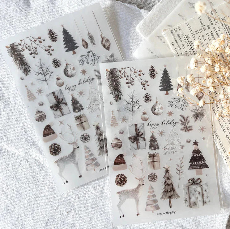 Set of Christmas Selection Transfer Sticker sheets with festive deco on a textured surface