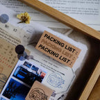 Packing list card with decorative elements on a wooden surface