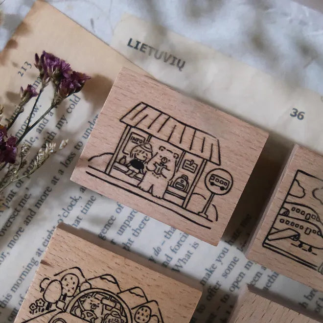 Wooden stamps with illustrations on a textured surface