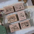 Set of wooden stamps with illustrations on a book page